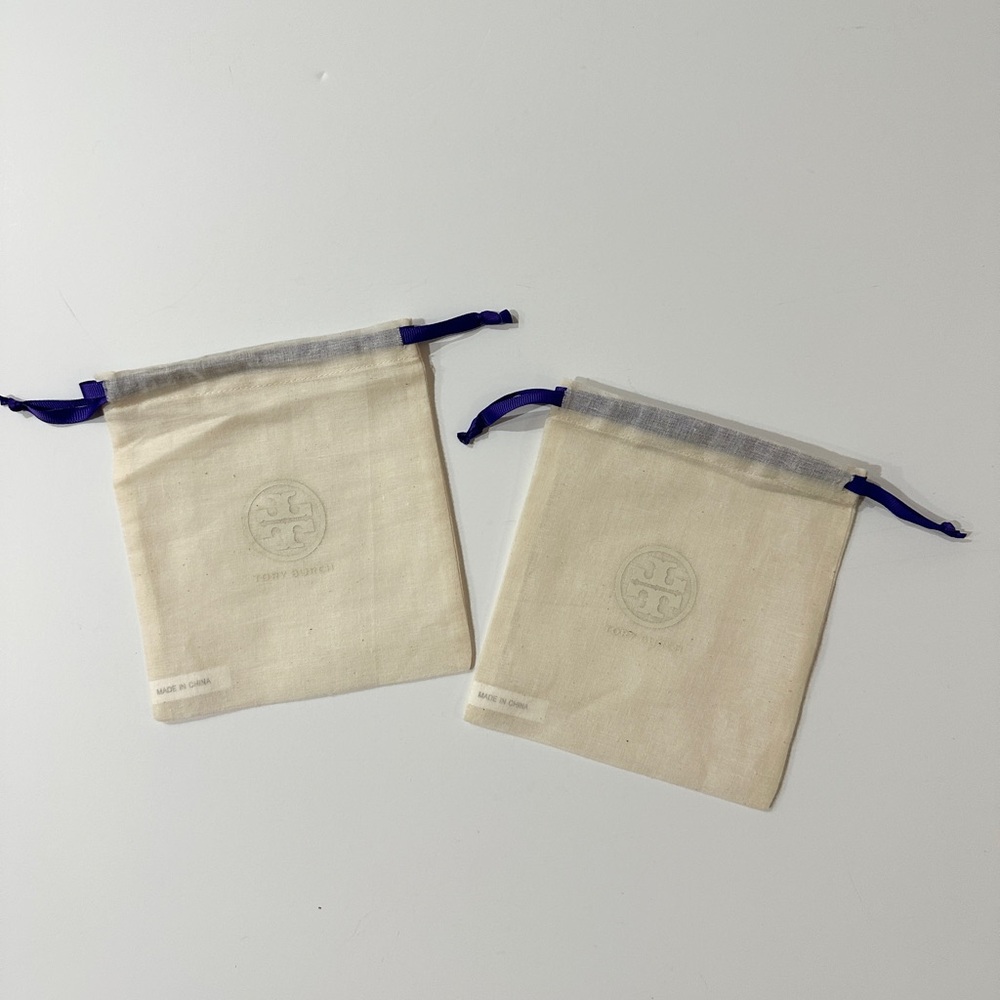 Two Tory Burch Cream Canvas Drawstring Pouches with Purple Trim